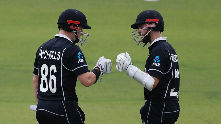 New Zealand batsmen Henry Nicholls and Kane Williamson are mid-fist bump during the Cricket World Cup final.