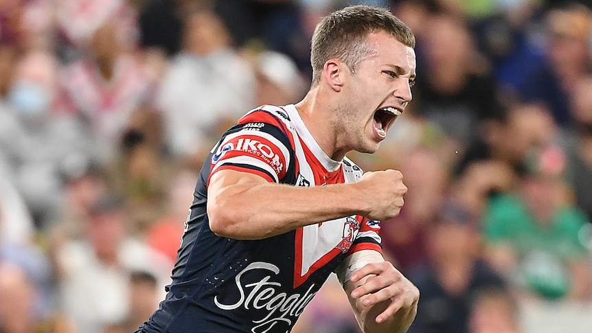 A Sydney Roosters NRL player celebrates kicking a field goal against the Gold Coast Titans.
