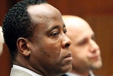 On trial: defence attorneys sit beside Conrad Murray
