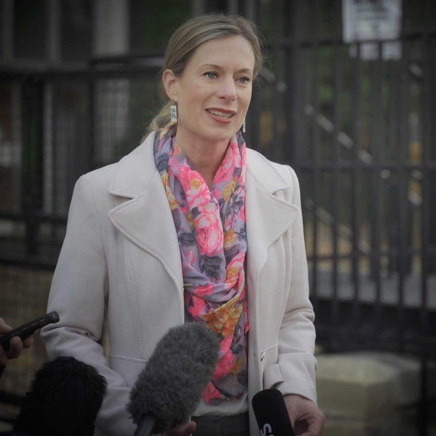 Tasmanian Labor Leader Rebecca White stands in a street.