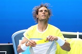 Shock exit ... Rafael Nadal gathers his thoughts during his first-round match against Fernando Verdasco