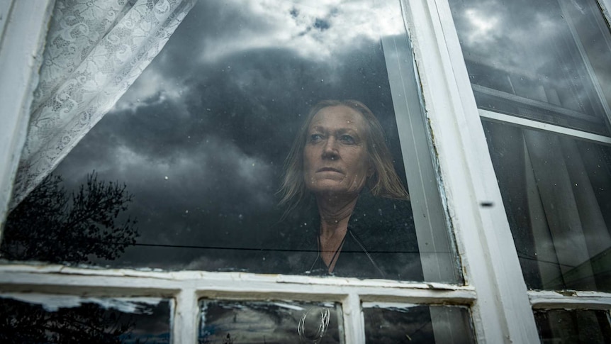 Donna Dickson looks out the window of her home in Armidale.