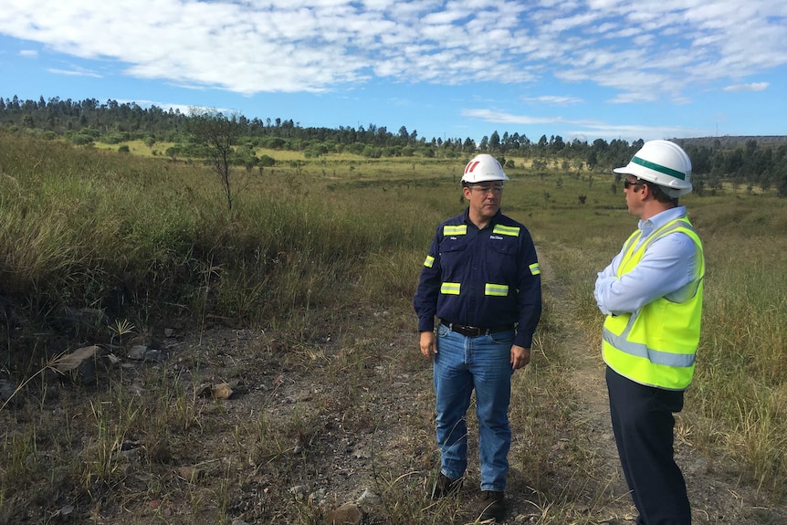 Steven Miles and Michael Priestly talking in Hail Creek coal mine