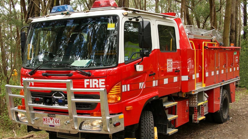 A CFA tanker sits in bushland.