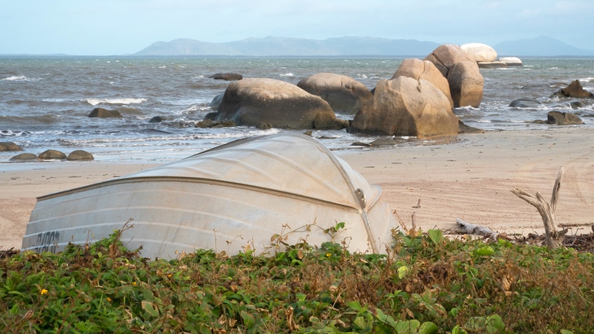 A boat lying on the foreshore of Lockhart River in Cape York