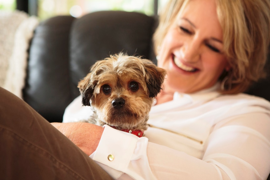 Karen Justice with her dog Daisy on her lap