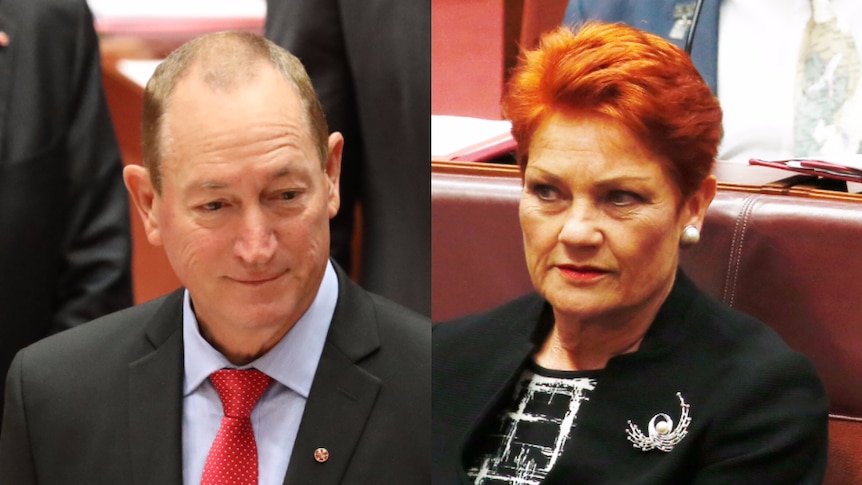 Pauline Hanson looks towards a smiling Fraser Anning.