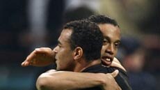 Cafu of AC Milan will line up against Ronaldinho in the Champions League semi-final tomorrow morning.