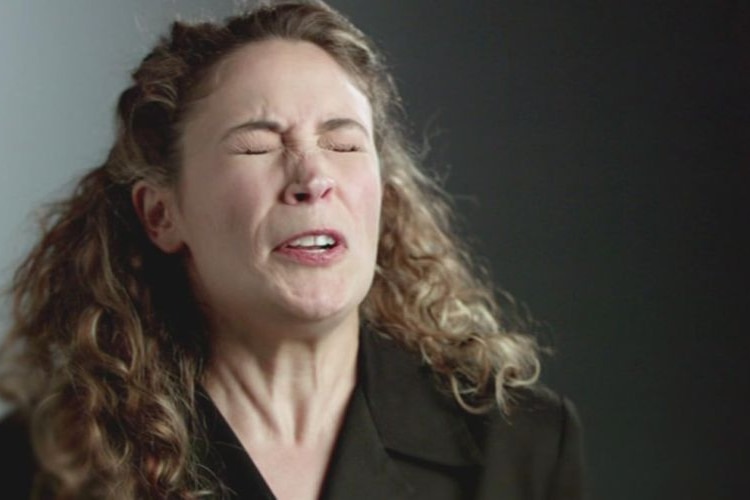 A woman about to sneeze