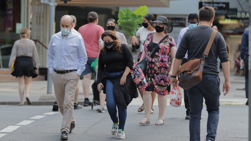 Pedestrians wearing masks