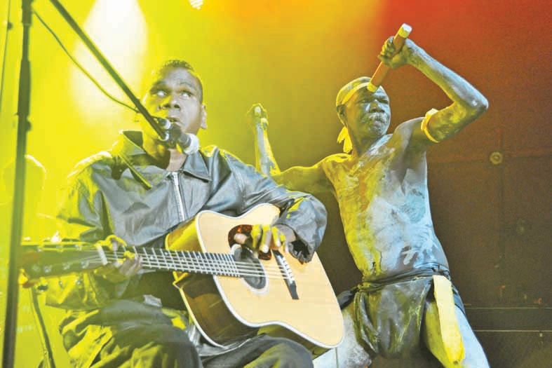 two aboriginal men performing on stage