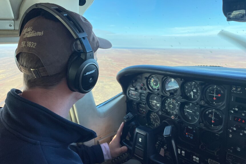 Pilot Jonathon Rae flies a plane over Channel Country
