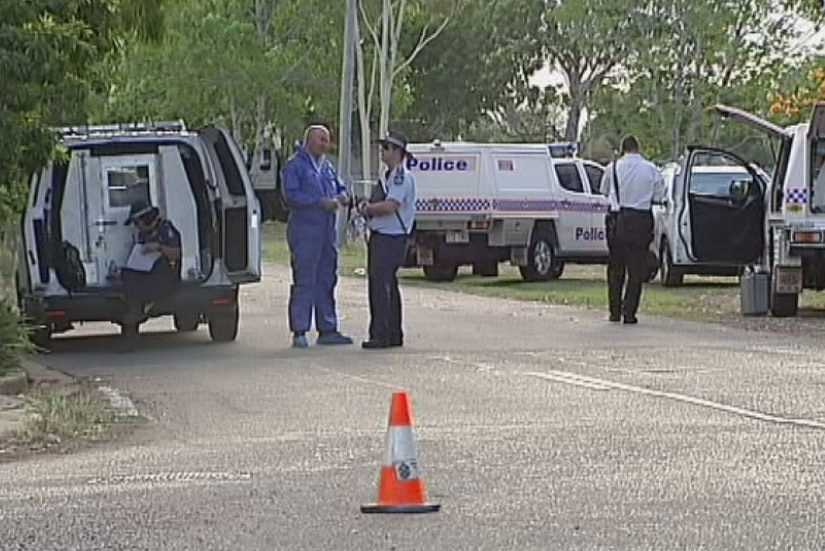 Police and forensic officers outside a house where a woman was found dead in Townsville