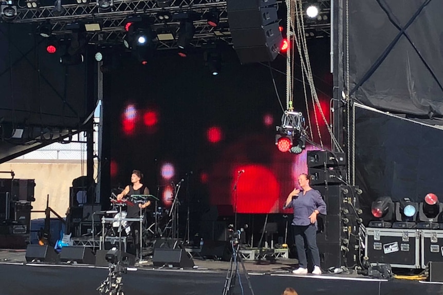 Auslan interpreter Susan Emerson interpreting on the main stage.