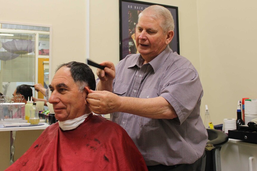 Broken Hill barber Graham Rowe (right).