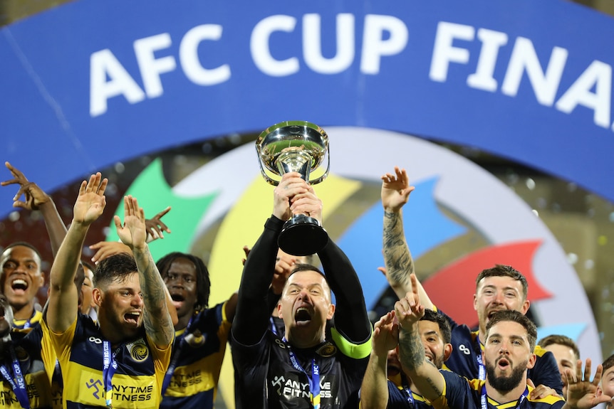 The Central Coast Mariners on the podium, celebrating with the AFC Cup