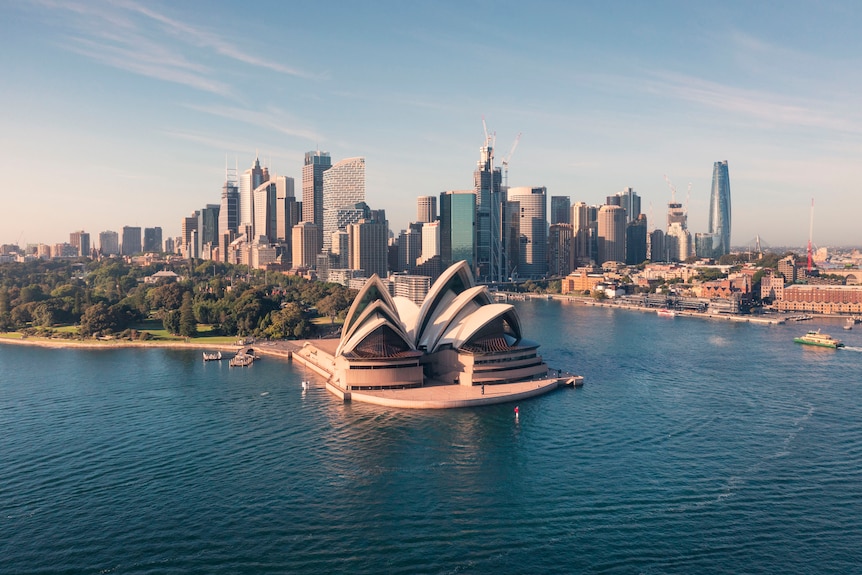 The Sydney Opera House on Sydney Harbour with buildings in the background