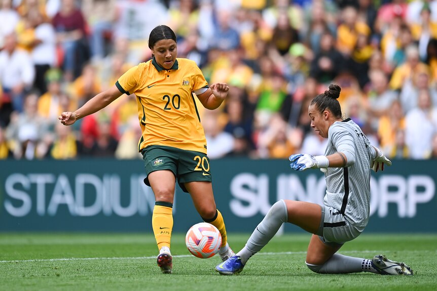 Sam Kerr is tackled by the goalkeeper