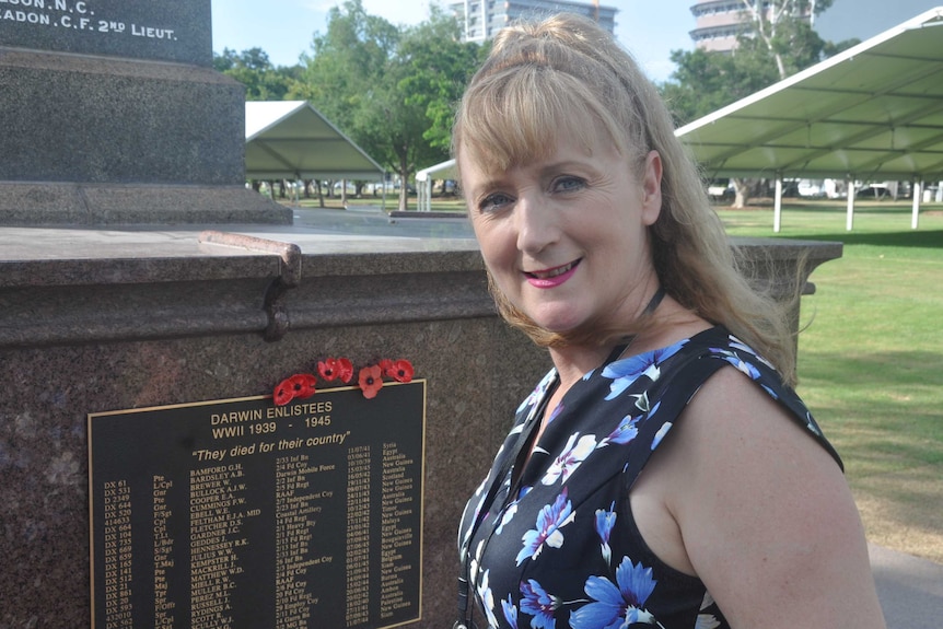 Kerryn Smith standing in front of the Darwin Cenotaph.
