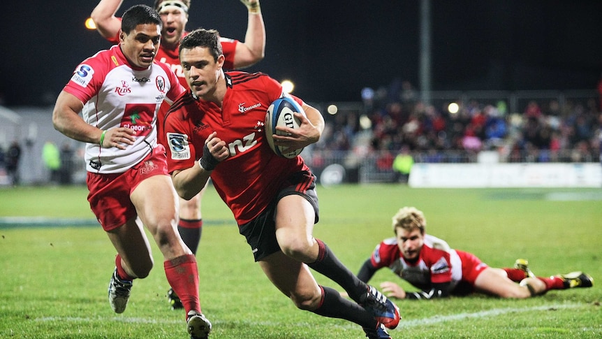 Crusaders' Dan Carter scores a try against the Reds in a Super Rugby qualifying final in July 2013.