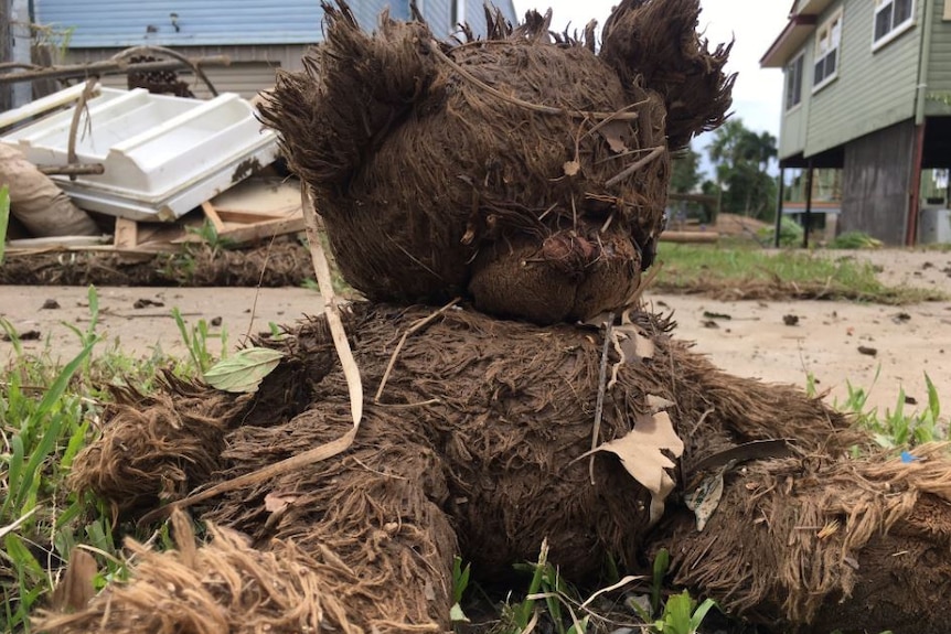 A dirty teddy bear sits on the side of the road in Murwillumbah.