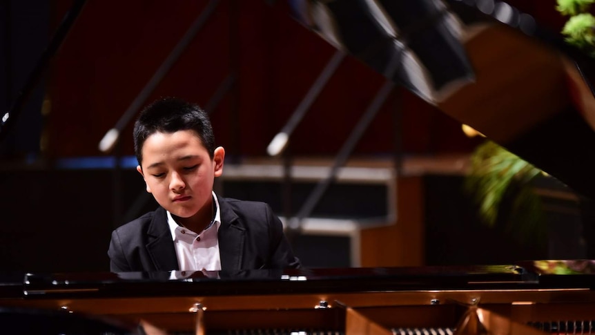 12-year-old Jeremy Sun, from Brisbane, playing the piano.
