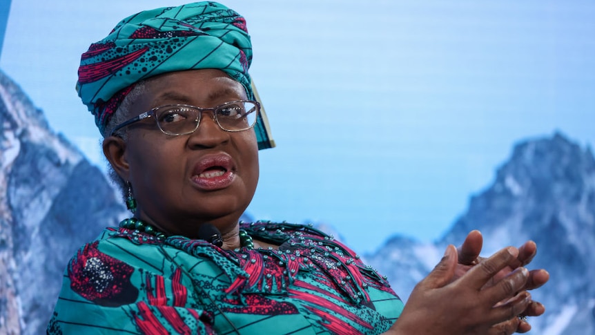 WTO director general Ngozi Okonjo-Iweala wers bright African fabric while speaking at the World Economic Forum