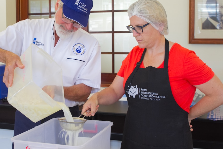 The curds are separated from the whey through a sieve.