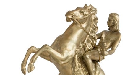 A sculpture of musician Nick Cave astride a rearing horse, dressed in a loin cloth