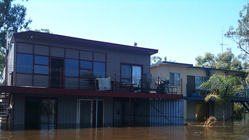 Floodwaters down the Murray swallow shacks at Morgan in the Riverland