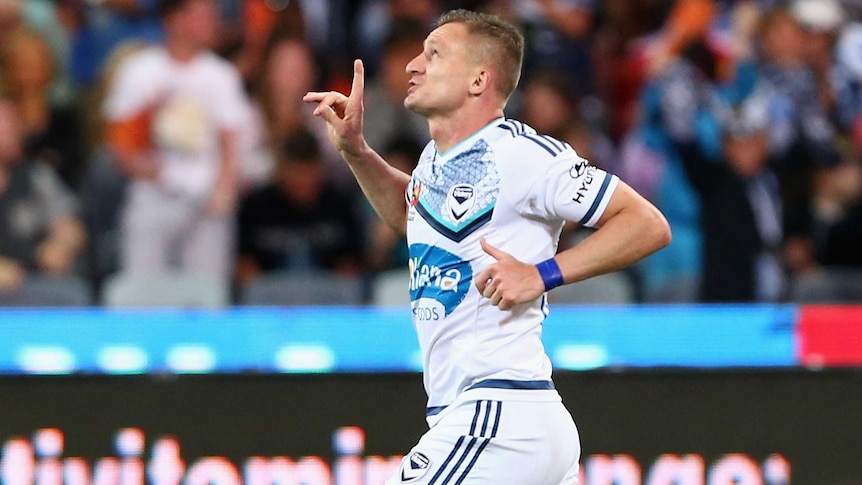 Cometh the hour ... Besart Berisha celebrates his opening goal for the Victory against the Mariners