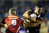 New Zealand's Joey Manu tries to get past Adam Doueihi of Lebanon at the Rugby League World Cup.