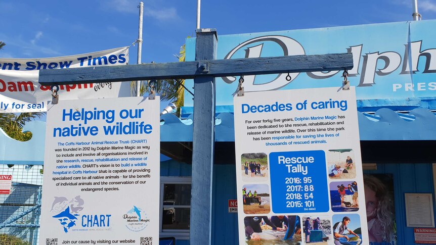 Signs outside Dolphin Marine Magic outline the rescue and rehabilitation work done on site