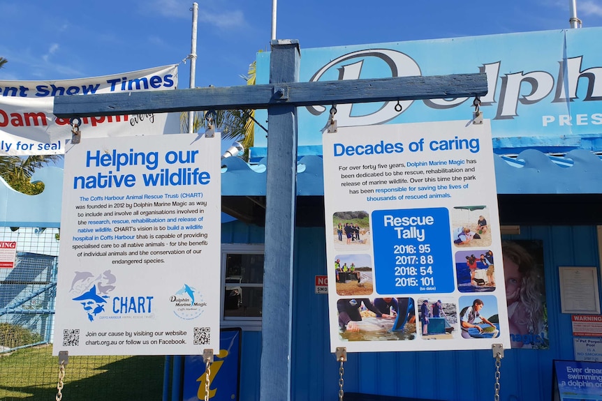 Signs outside Dolphin Marine Magic outline the rescue and rehabilitation work done on site