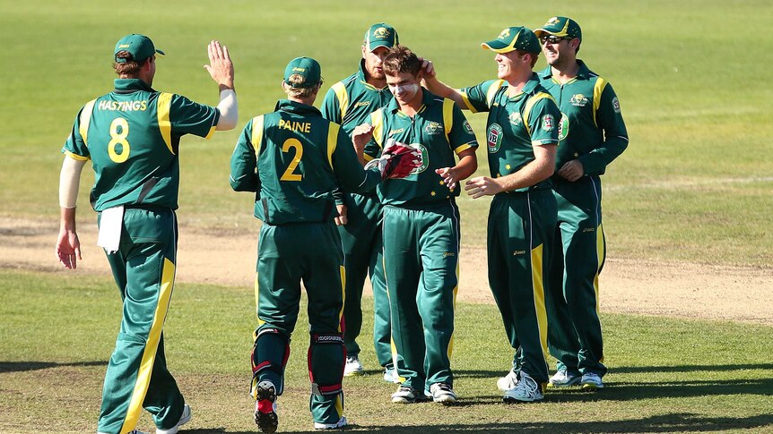 Australia A's Cameron Boyce (C) is congratulated after taking a wicket against the England Lions.