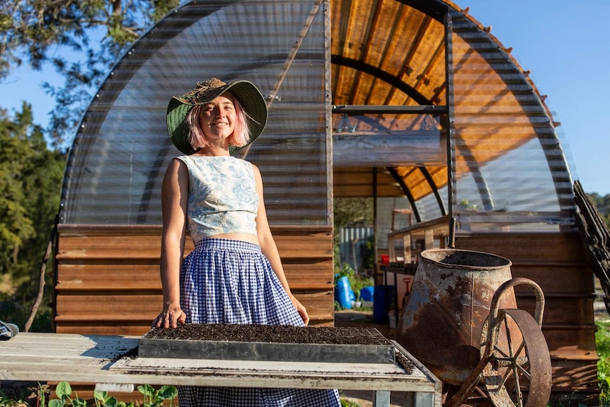 Alice smiling while planting Beetroot and Fennel seeds into a tray, taken in Samford Valley, Queensland, on 24th July 2018