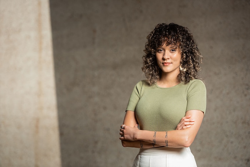 A woman poses for a professional portrait