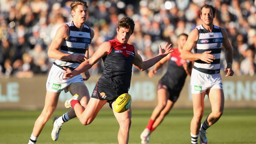 Brayshaw clears the ball against Geelong