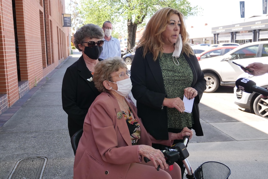 three ladies addressing media