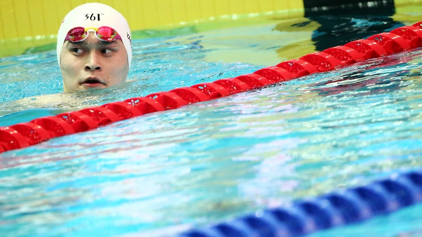 Sun Yang looks on from the swimming pool.