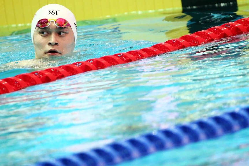 Sun Yang looks on from the swimming pool.