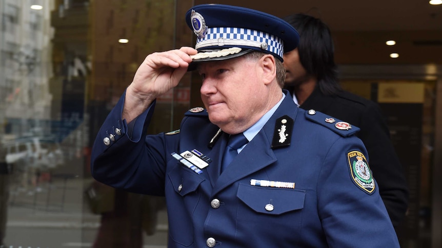 NSW Police Acting Deputy Commissioner Jeff Loy leaves the Sydney siege inquest today.