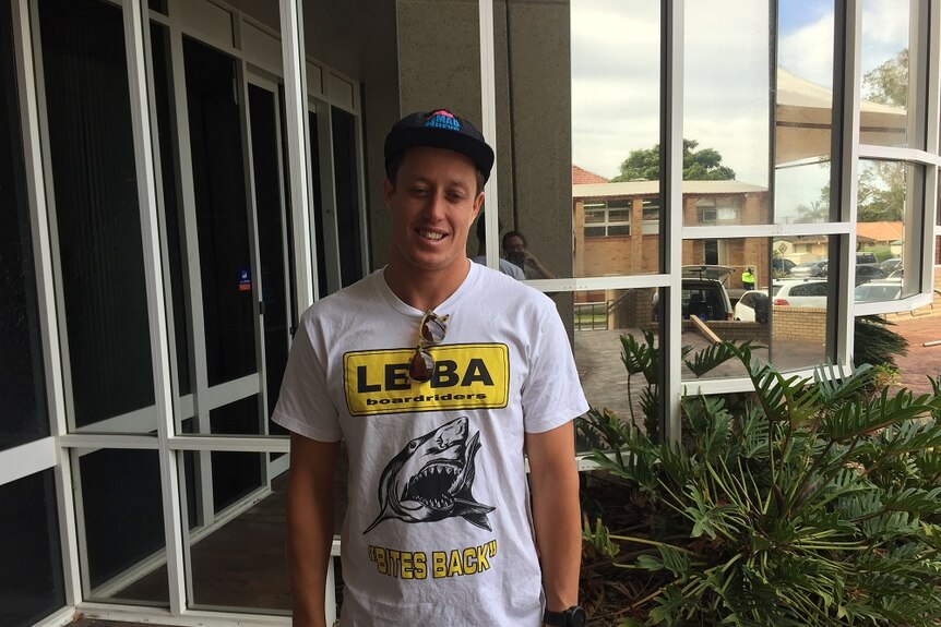 Champion surfer James Wood in a shark-themed tee shirt proclaiming "Le-Ba bites back".