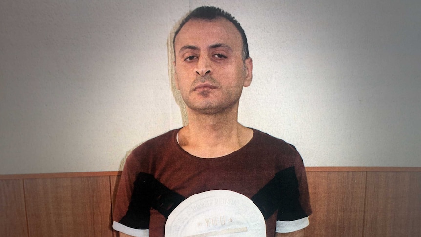 Amer Khayat poses for a mugshot