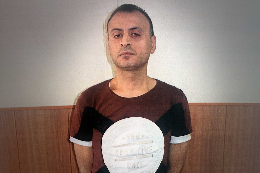 Amer Khayat poses for a mugshot