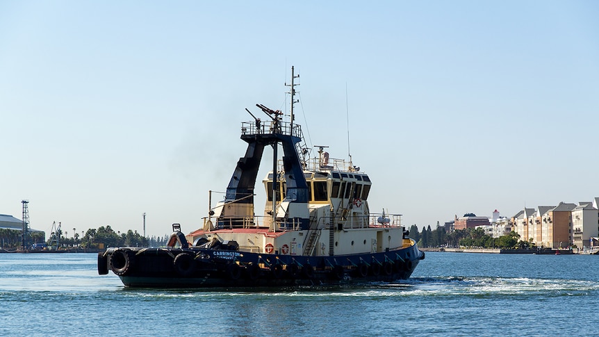 A tug turns on Newcastle harbour.