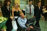 British scientist Stephen Hawking is welcomed by Chinese people as he arrives at the Beijing Hotel.
