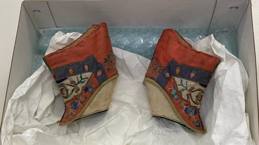 Tiny, embroided ancient shoes