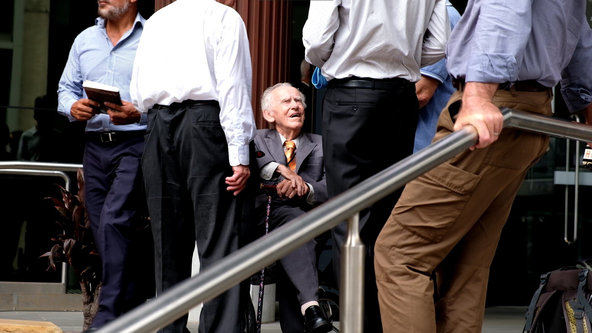 An older man outside of court.
