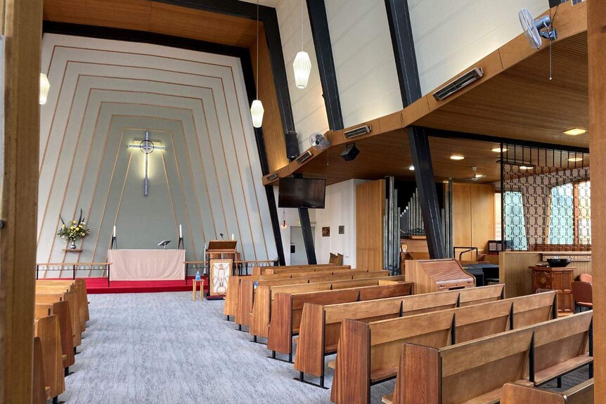 Light-filled interior of a mid-century modern church.